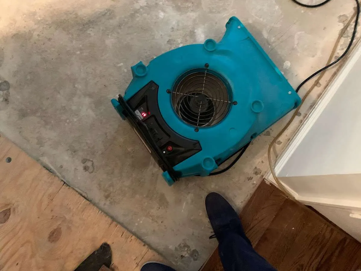 Air mover drying subfloor during Leak Detection & Repair in Pahokee
